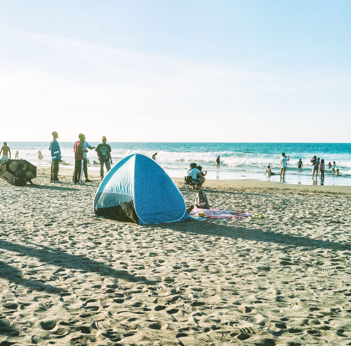 A beach tent on warm sand by the sea